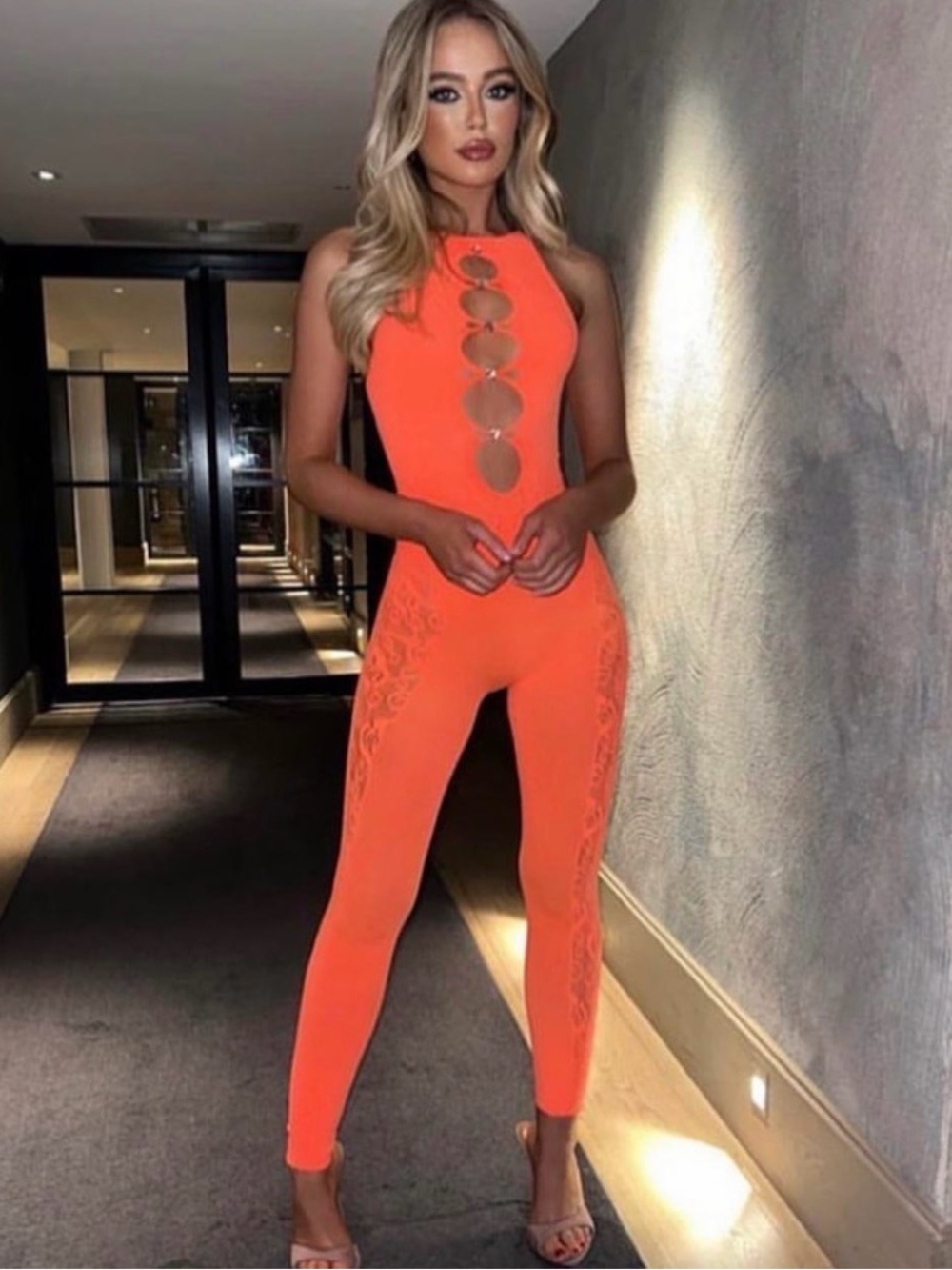 Poster Girl Style Neon Orange Sleeveless Cutout Ring-Front Jumpsuit